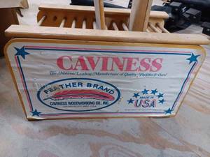 lot 89 image: Caviness Feather Brand Wooden Canoe Paddle Retail Display Stand with Two Used Wooden Canoe Paddles