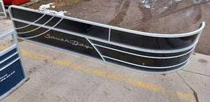lot 124 image: Used Sun Tracker, and Two Used South Bay Pontoon Deck Panels