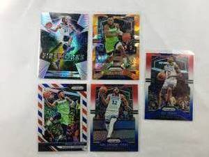 lot 30 image: Lot of 5 Timberwolves Jimmy Butler Prizm #67, Karl-Anthony Towns Prizm #161, Josh Okogie Prizm #163, Jeff Teague Prizm #165, Andrew Wiggins Fireworks #10