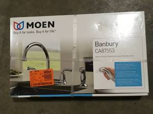 lot 9 image: Banbury 2-Handle Mid-Arc Standard Kitchen Faucet with Side Sprayer in Chrome by MOEN  Customer Returns See Pictures