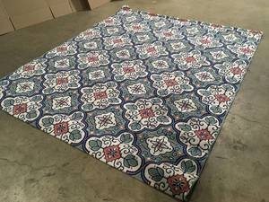 lot 22 image: Star Moroccan 8 ft. x 10 ft. TealWhite IndoorOutdoor Patio Area Rug by Hampton Bay  customer Returns See Pictures
