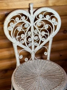 lot 37 image: Vintage White Heart Peacock Wicker Chair