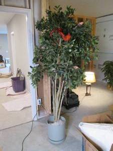 Large artificial tree with a bird a...