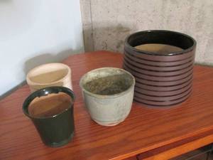 Lot of planters and a butter crock...