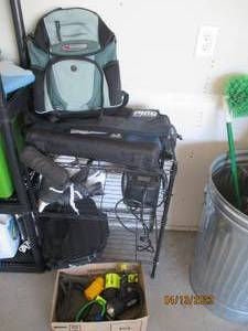 Metal shelf with an AC air compress...