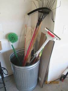 Metal can filled with home and yard...