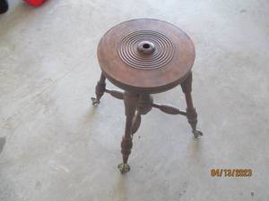 Antique wood stool with claw feet...