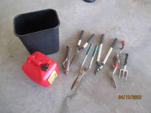 Garden tools, gas can and trash can...