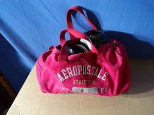 lot 118 image: Aeropostle Bag Full of Blenders Pots Pan and a Skillet