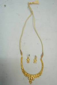 lot 21 image: Gold tone Necklace and Earrings