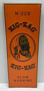 lot 6 image: Zig-Zag Tin Sign 24 x 9