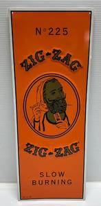 lot 19 image: Zig-Zag Tin Sign 24 x 9