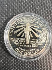1986 US SILVER DOLLAR ELLIS ISLAND COMMEM IN AIRTITE