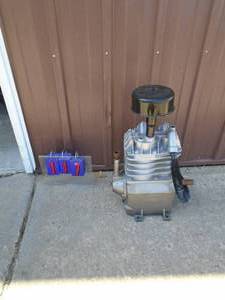 Large Air compressor pump. Consignor says rebuilt pulley included but not shown in pcis. Looks like a 5 hp motor THIS ITEM HAS A RESERVE.