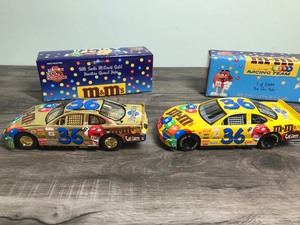 lot 157 image: 1999 NASCAR Racing Champions 2 car set Ernie Irvan #36  M&Ms 124 scale die cast stock cars