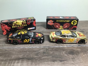 lot 159 image: 1999 NASCAR Racing Champions 2 car set Jeff Burton #99  Bruce Lee 124 scale die cast stock car