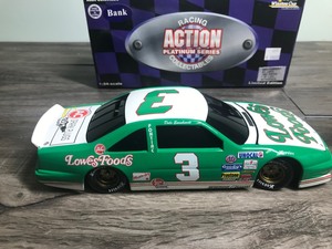 lot 207 image: NASCAR Racing Action Platinum Series 1989 Pontiac Dale Earnhardt #3  Lowes 124 scale die cast coin bank