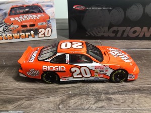 lot 235 image: 2001 Nascar Action RCCA edition Tony Stewart #20  Home Depot 124 scale die cast Grand Prix clear window coin bank stock car