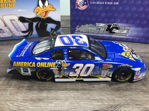 lot 244 image: 2002 Nascar Action Racing Collectibles 10th anniversary Jeff Green #30 AOL  Looney Tunes Rematch 124 scale die cast stock car