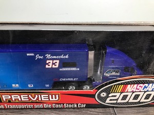 lot 292 image: 2000 Nascar Racing Champions Preview Series Joe Nemechek #34 transporter and stock car 164 scale