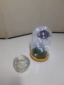lot 33 image: Lighted rose and heavy glass Candle holder