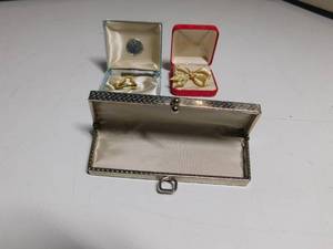 lot 62 image: Trifari and Roman pins and clutch purse