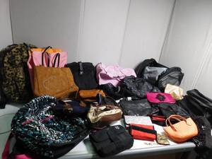 lot 84 image: Purses, billfolds, and backpacks
