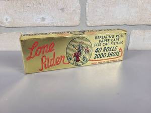 lot 305 image: Vintage Lone Rider Repeating Roll Paper Caps - Box is Full
