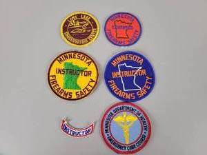 lot 474 image: Vintage Minnesota Firearms Safety Patches, Department of Health and More