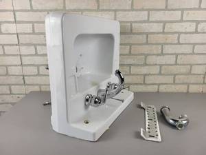 lot 1053 image: CRANE Wall-Mount Porcelain Sink with Mounting Bracket and Faucet - NO SHIPPING