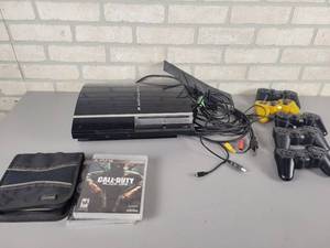 lot 1205 image: SONY PlayStation 3 - (5) Controllers, Cables and (8) Games - Powers On