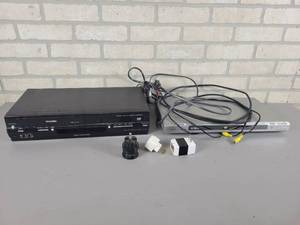 lot 1212 image: TOSHIBA VHSDVD Player and SONY DVD Player  (3) Converter Plugs