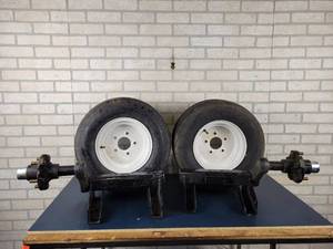 lot 1009 image: (2) NEW Torsion Axles w NEW Rims & Tires - 5-Bolt - 2700LB Capacity - NO SHIPPING