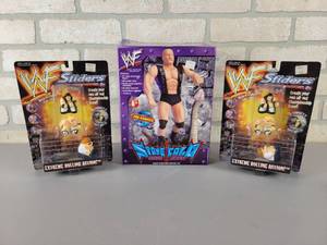 lot 556 image: WWF Collectables - Stone Cold Steve Austin Model and (2) WWF Sliders Toys
