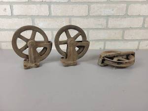 lot 578 image: (3) Antique Cast Iron Barn Pulleys