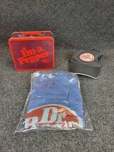 lot 670 image: Lot of Dr. Pepper Memorabilia - Lunchbox, Baseball Cap, and T-Shirt (Size XL)