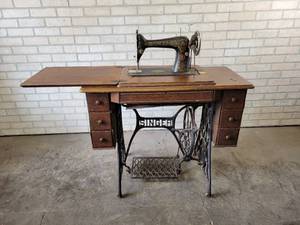 lot 709 image: Antique Singer Sewing Machine with Cast Iron Base and Wood Cabinet - NO SHIPPING