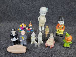 lot 753 image: Lot of New & Vintage Toys - Porcelain Dolls, (2) Dopey Bisques, Goof Troop Figurines, Addams Family Flashlights, and More