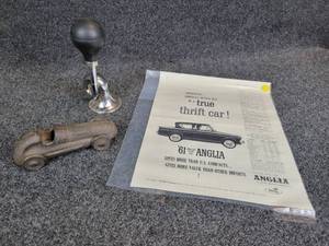 lot 899 image: 1961 Ford Anglia Ad, Cast Iron Roadster Car, and Horn
