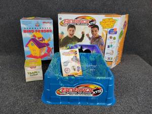 lot 912 image: NEW in Box Schoolhouse Bird Feeder, Beyblade Extreme Top System, and Vintage Softball New in Box