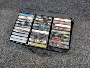 lot 955 image: Lot of (29) Audio Cassettes from the 80s and 90s - Van Halen, Aerosmith, Heart, ACDC, and MORE