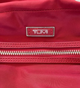 lot 110 image: Tumi Crossbody Handbag