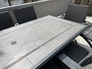 lot 2 image: Tile Top Patio Table with 8 Chairs