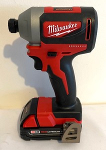 lot 202 image: Milwaukee Tools Hammer DrillDriver and Hex Impact Driver with Drill Bits