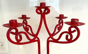lot 208 image: Red Cast Iron Candle Holder