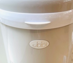 lot 235 image: Ubbi Diaper Pail and New Diapers