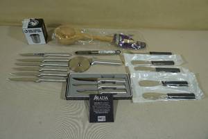 lot 30 image: Assorted Kitchen Procucts -Rada Knives, Rhino Cup, Ladle, Pizza Cutter