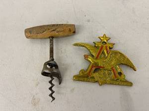 lot 133 image: Schlitz Beer Corkscrew & Anheuser Busch Metal Plate