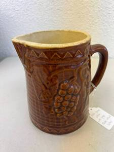 lot 54 image: Salt-Glazed Pitcher with Grape Cluster Rickrack Lattice