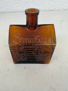 lot 67 image: Smokine Figural Whiskey Bottle